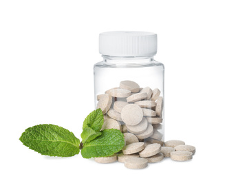 Bottle with vitamin pills and mint on white background