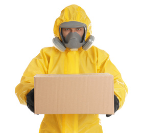 Photo of Man wearing chemical protective suit with cardboard box on white background. Prevention of virus spread