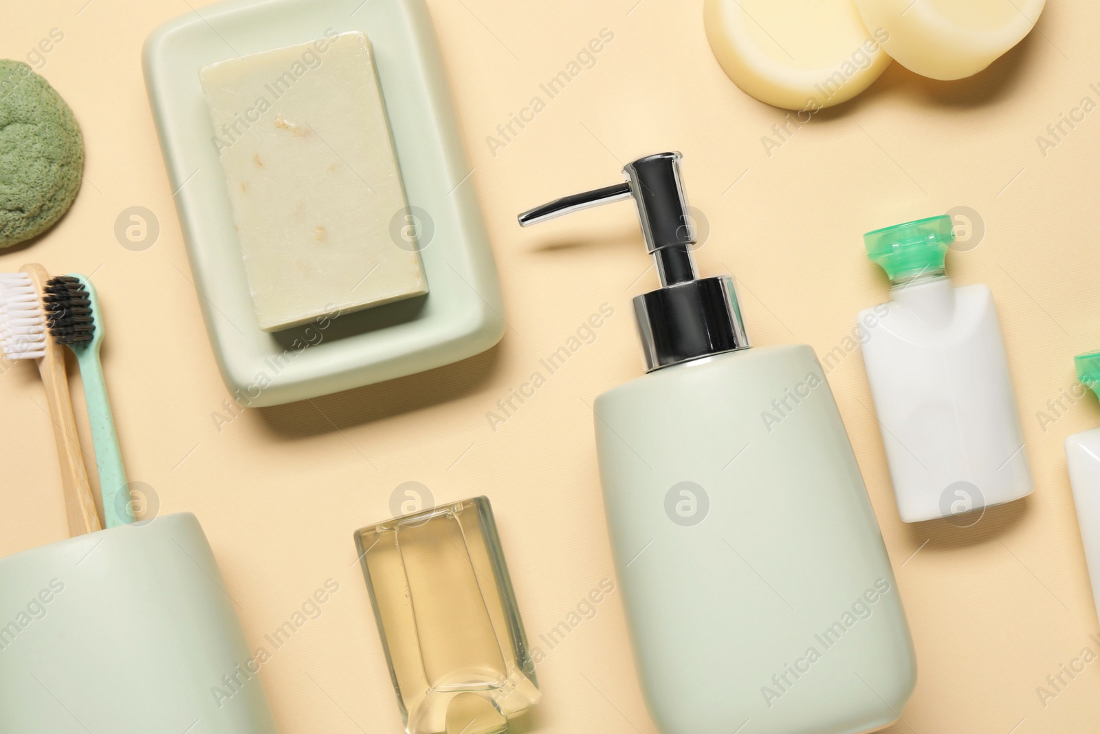 Photo of Bath accessories. Flat lay composition with personal care products on beige background