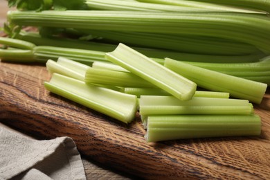 Fresh cut celery on wooden board, closeup