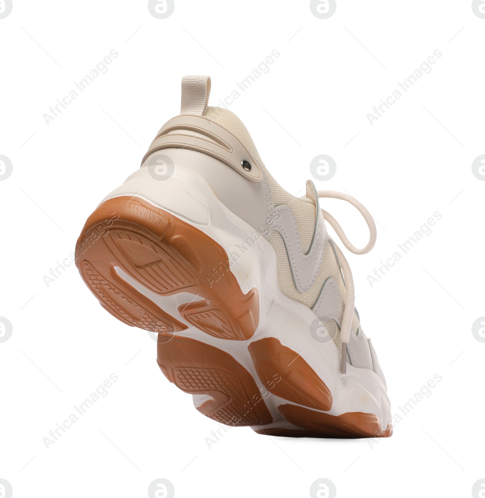 Photo of One stylish new sneaker isolated on white