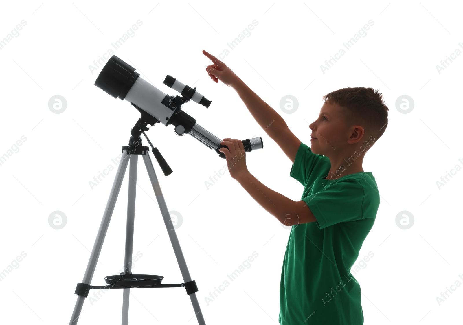 Photo of Cute little boy with telescope pointing at something on white background