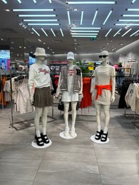 Photo of WARSAW, POLAND - JULY 17, 2022: Fashion store interior with women clothes on mannequins in shopping mall