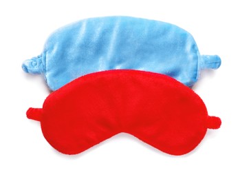 Photo of Two soft sleep masks isolated on white, top view