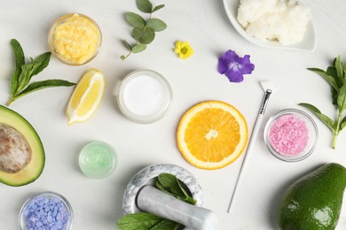 Flat lay composition with homemade cosmetic products and fresh ingredients on light grey background