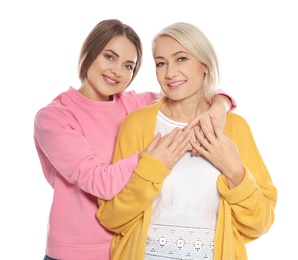 Portrait of mature woman and her daughter isolated on white