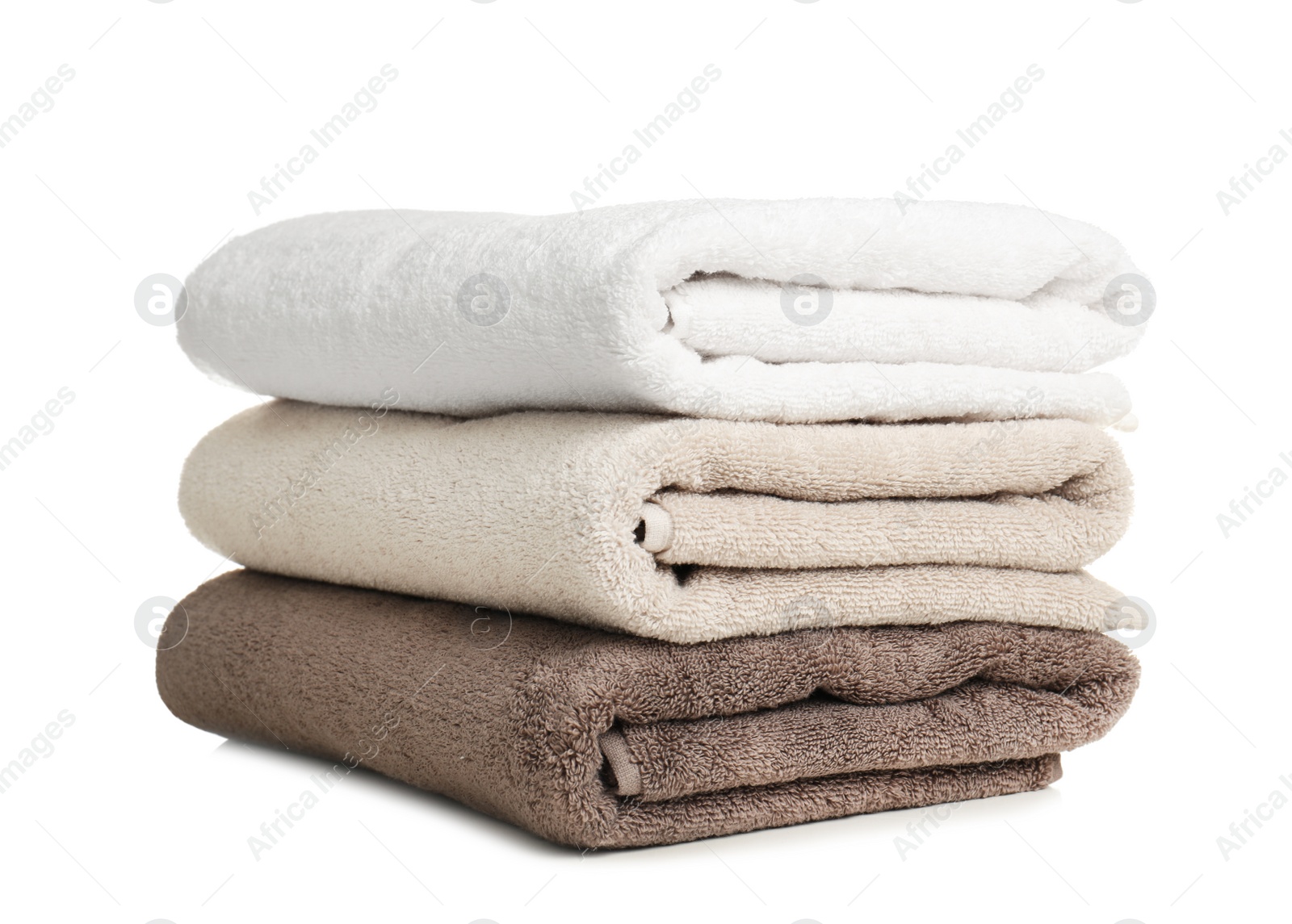 Photo of Folded soft terry towels on white background