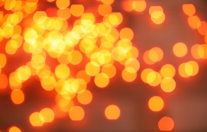 Photo of Beautiful gold lights on dark background. Bokeh effect