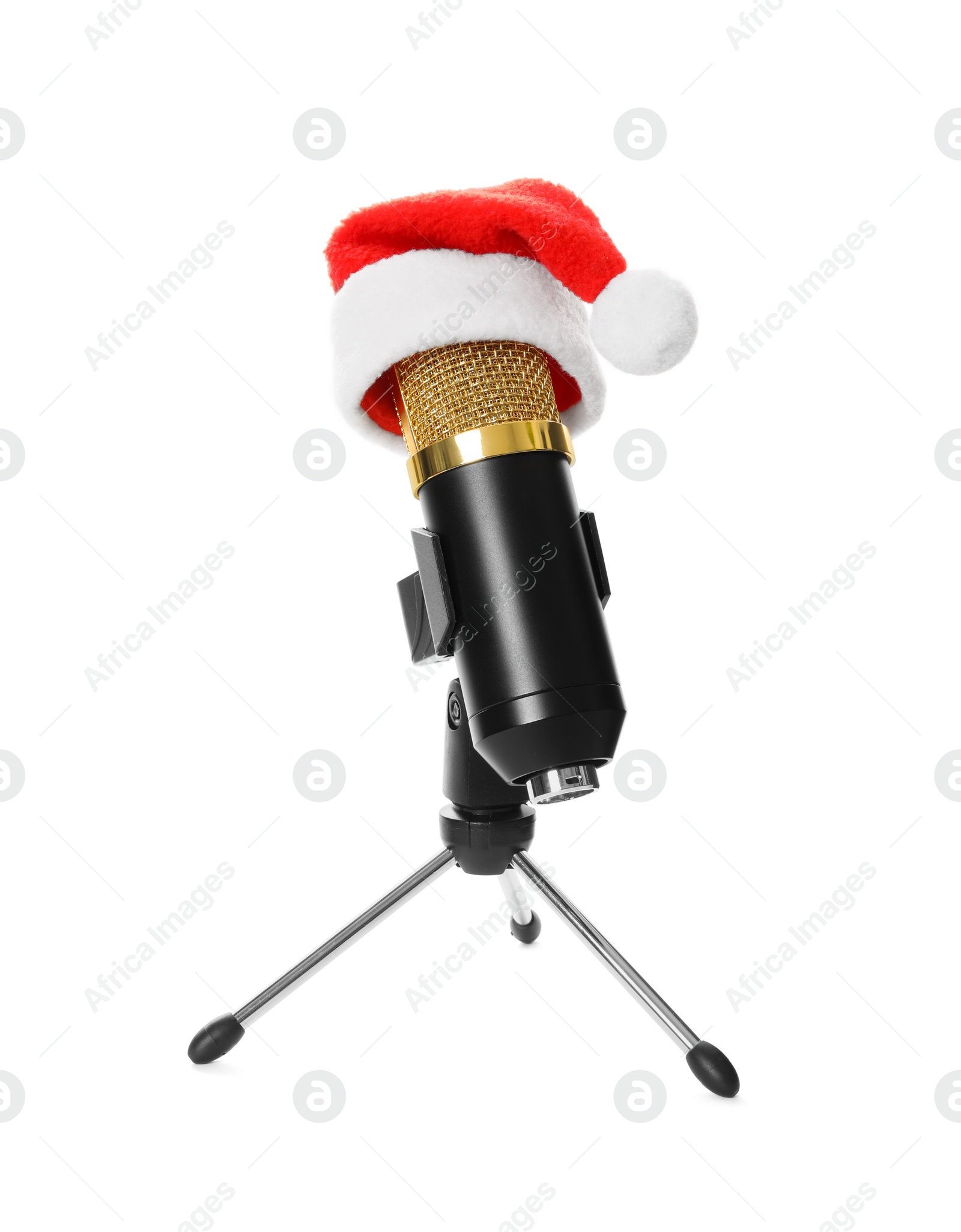 Photo of Microphone with Santa hat isolated on white. Christmas music