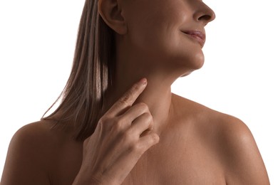 Mature woman touching her neck on white background, closeup