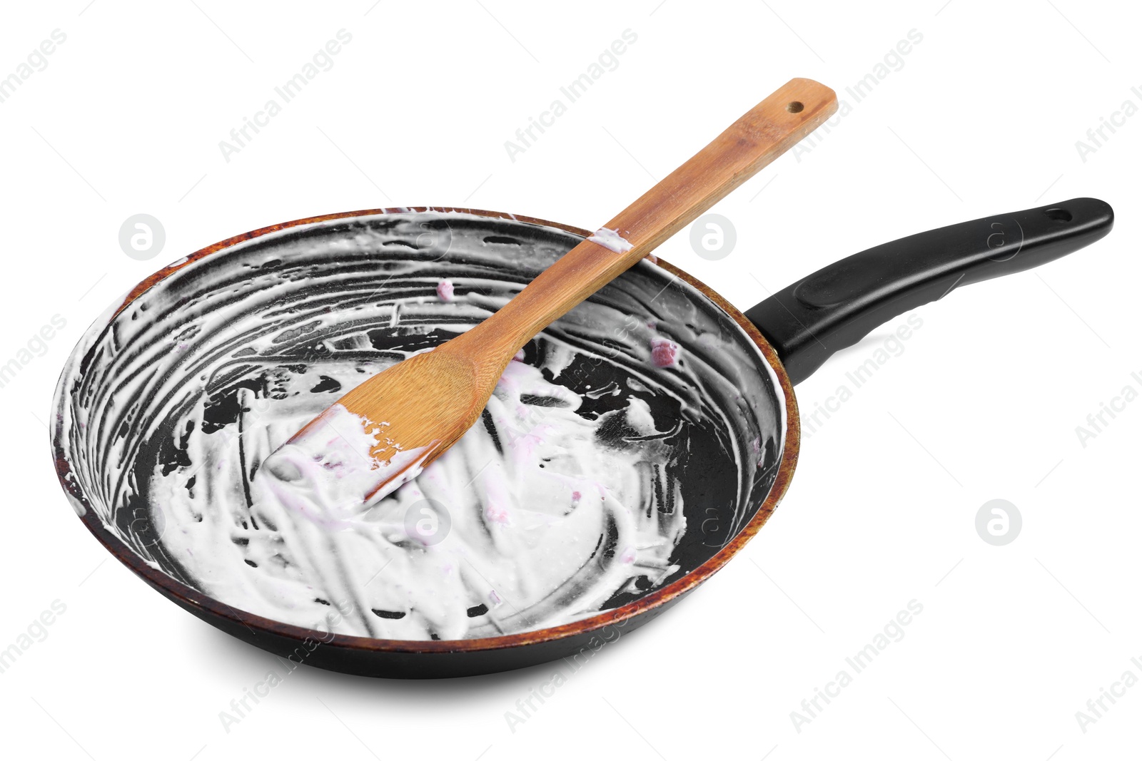 Photo of Dirty frying pan and wooden spatula on white background