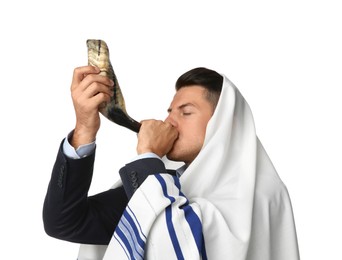 Photo of Jewish man in tallit blowing shofar on white background. Rosh Hashanah celebration