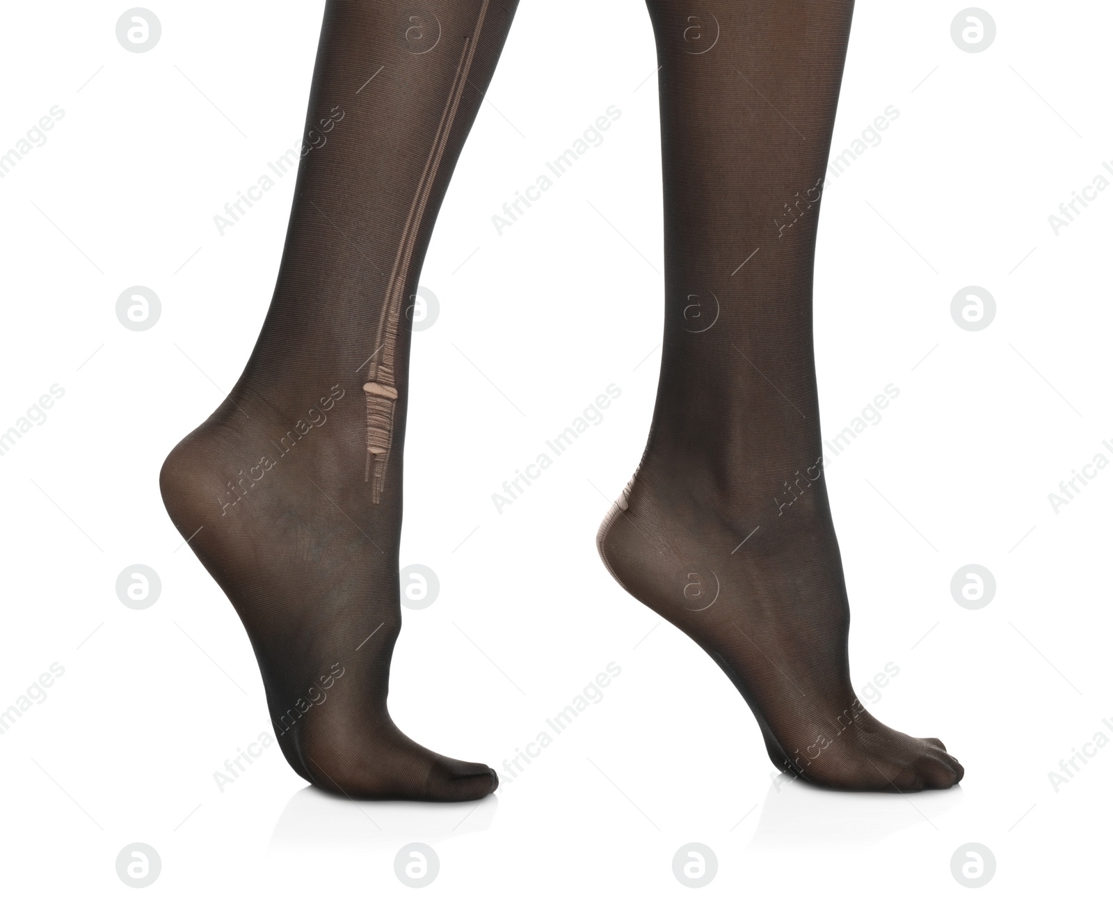 Photo of Woman wearing torn tights on white background, closeup