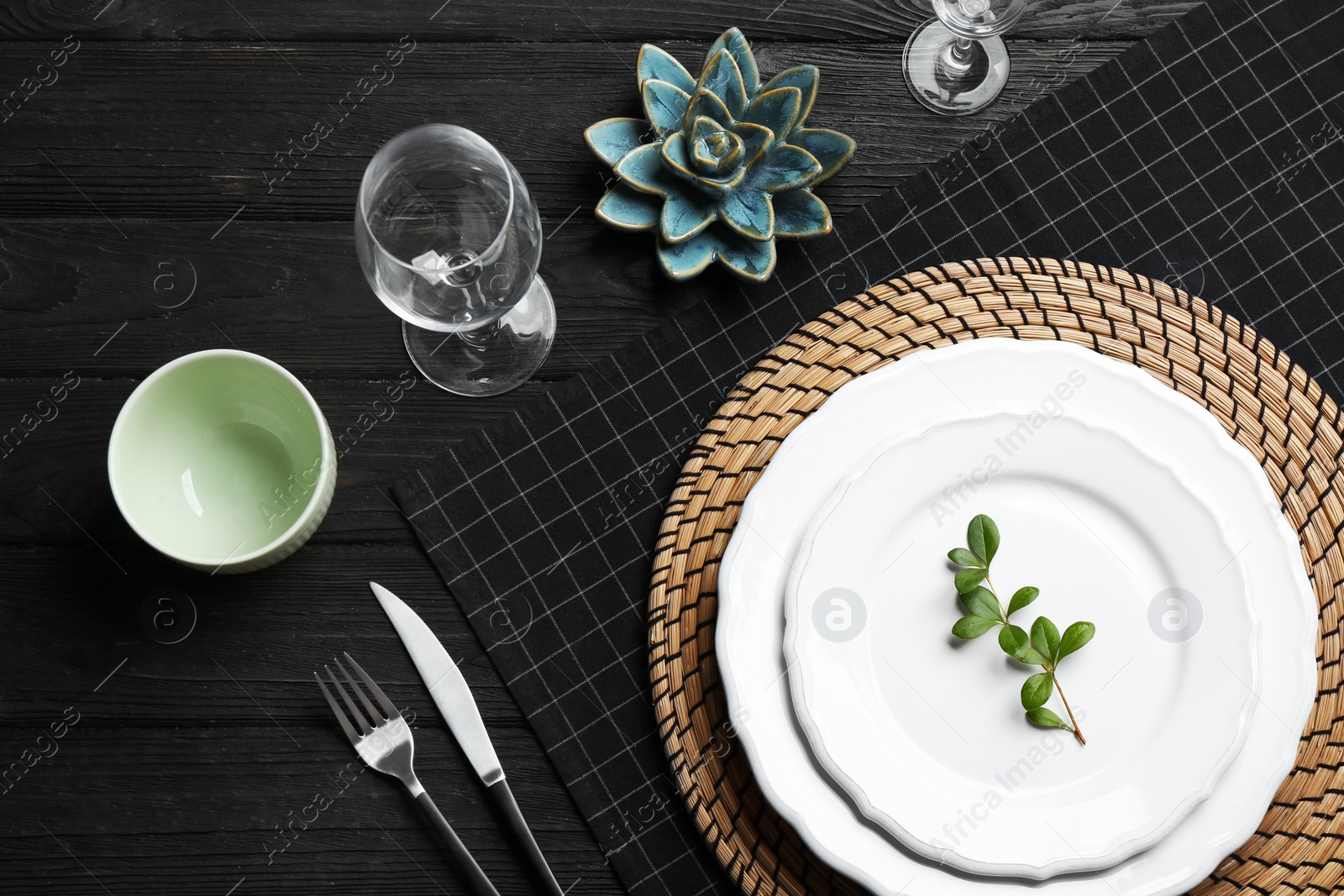 Photo of Elegant table setting on black wooden background, flat lay