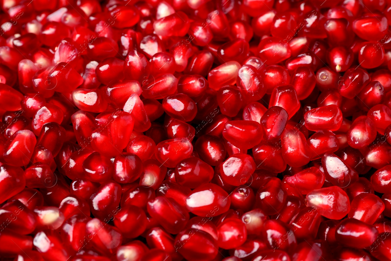 Photo of Many tasty pomegranate seeds as background, closeup