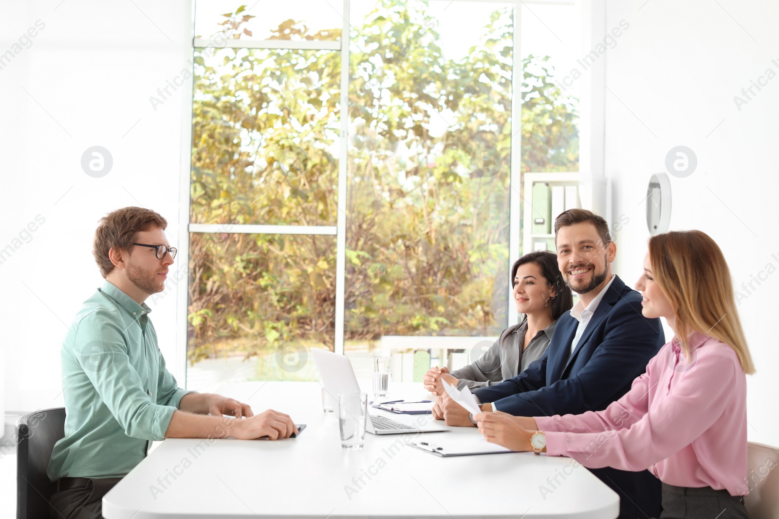 Photo of Human resources commission conducting job interview with applicant in office