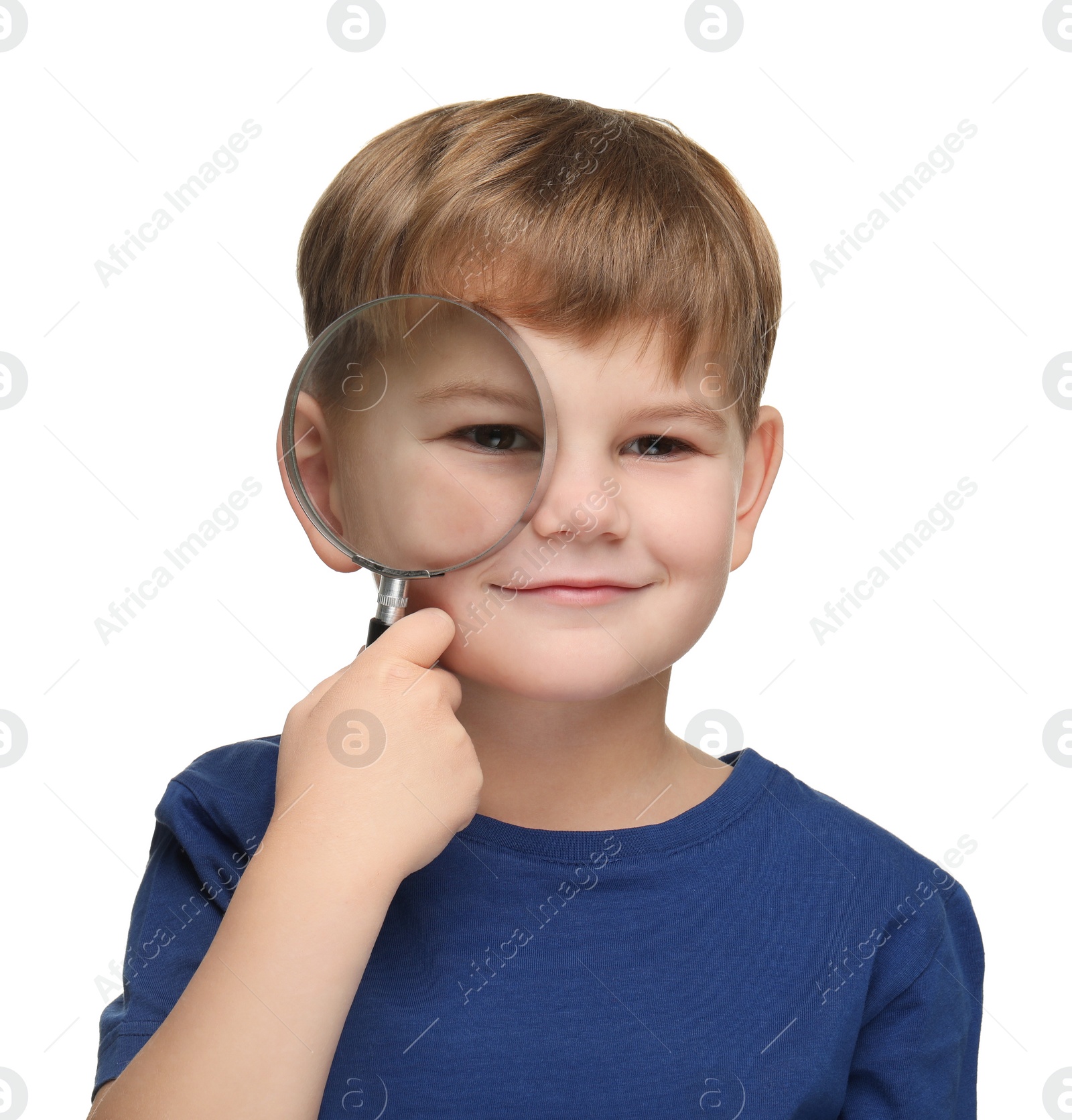 Photo of Little boy with magnifying glass on white background