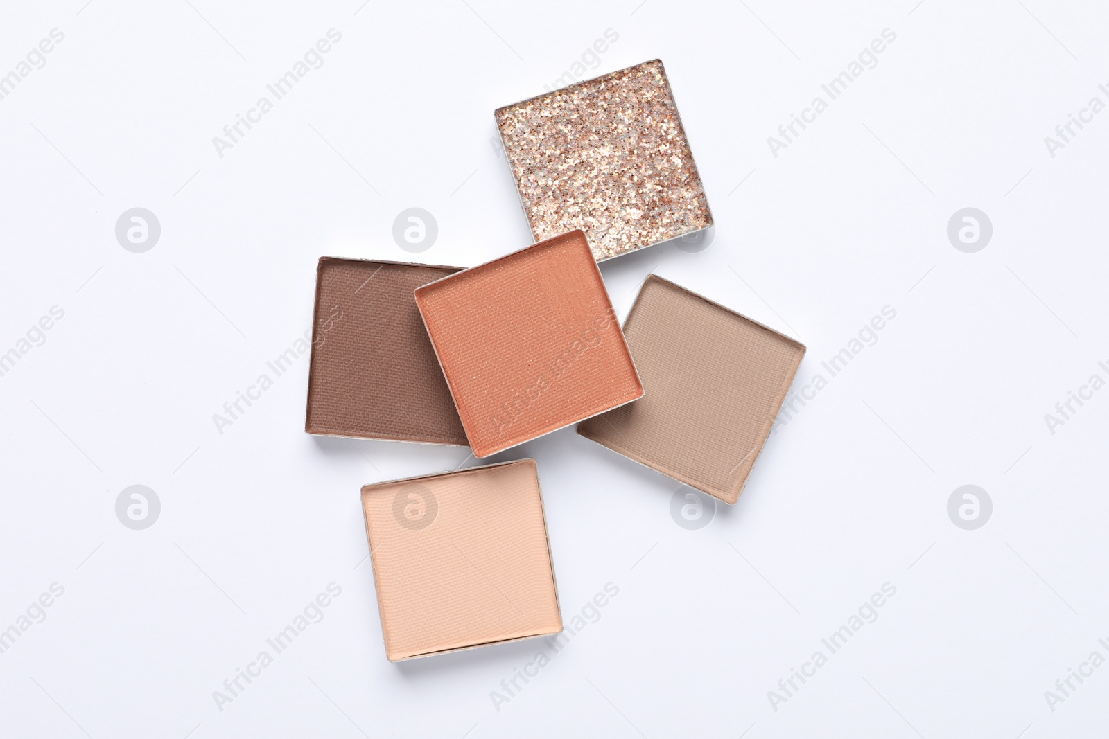 Photo of Beautiful eye shadow refill pans on white background, flat lay