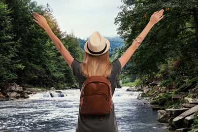 Traveler with backpack enjoying summer vacation trip