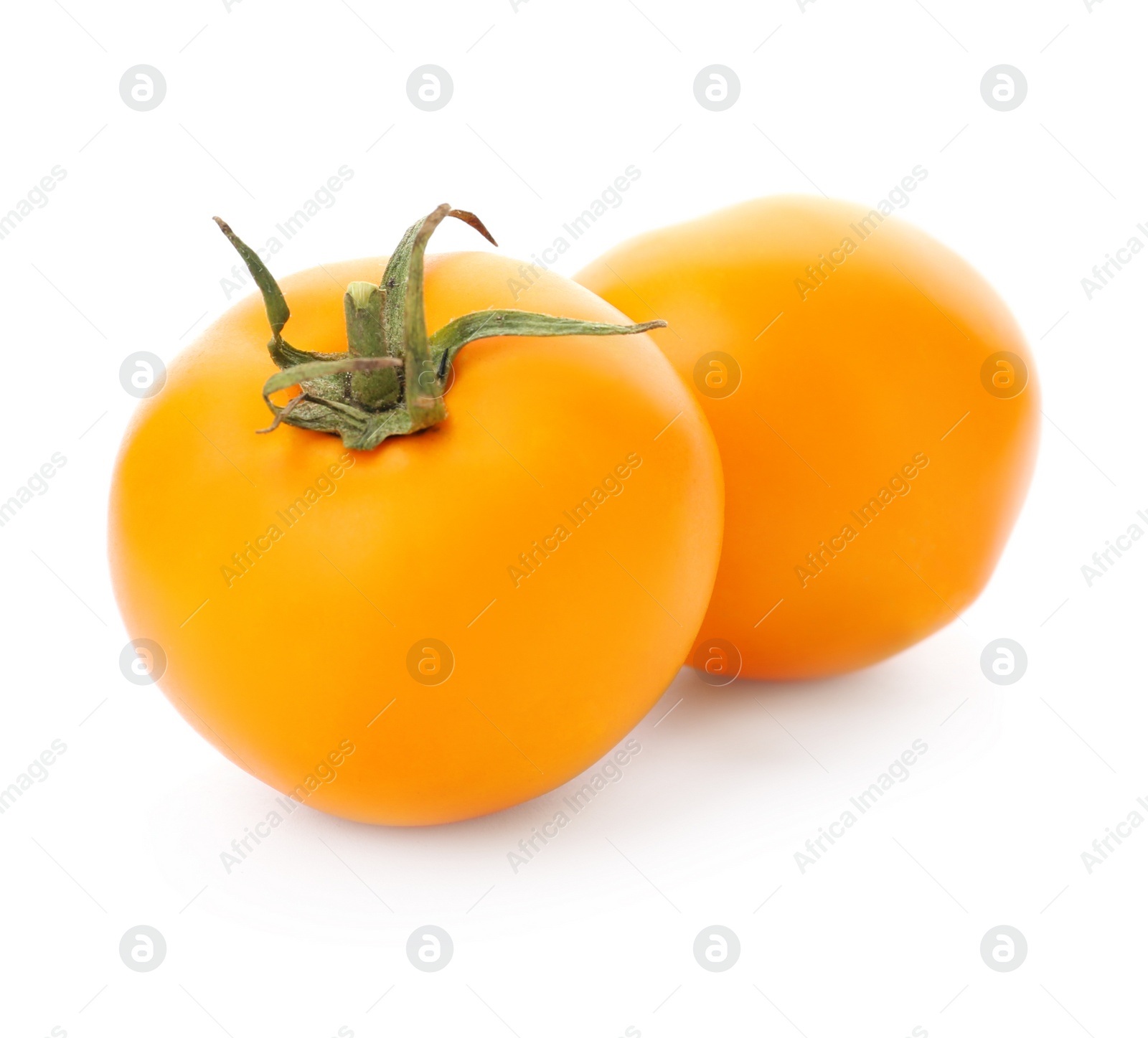 Photo of Delicious ripe orange tomatoes on white background