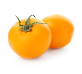 Photo of Delicious ripe orange tomatoes on white background