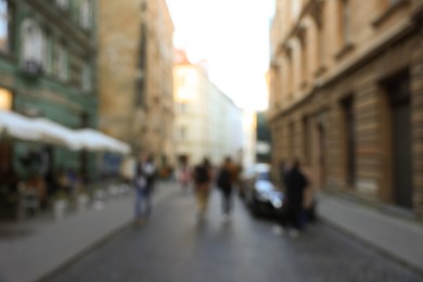 Blurred view of people walking on city street