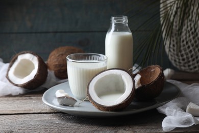 Photo of Composition with coconut milk on wooden table