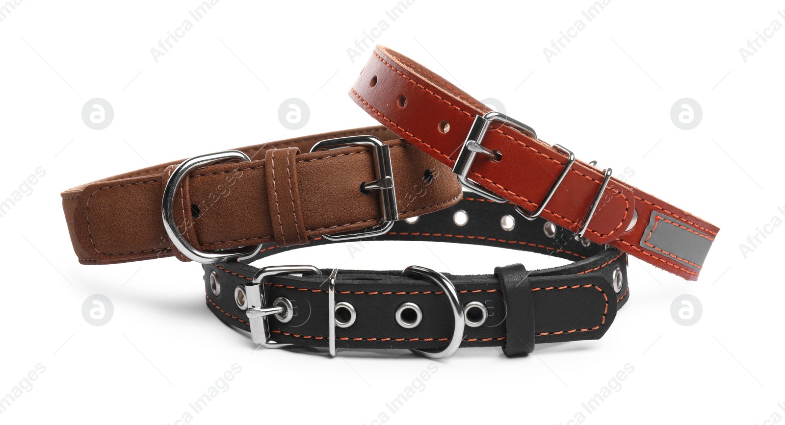 Photo of Different leather dog collars on white background