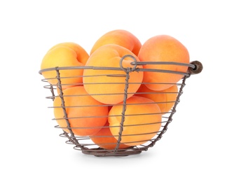 Photo of Basket of ripe apricots isolated on white