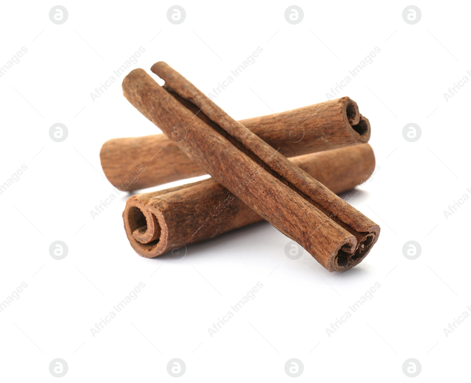 Photo of Aromatic cinnamon sticks on white background