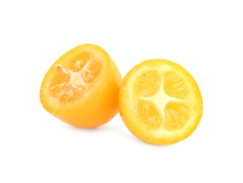 Halves of fresh ripe kumquat on white background