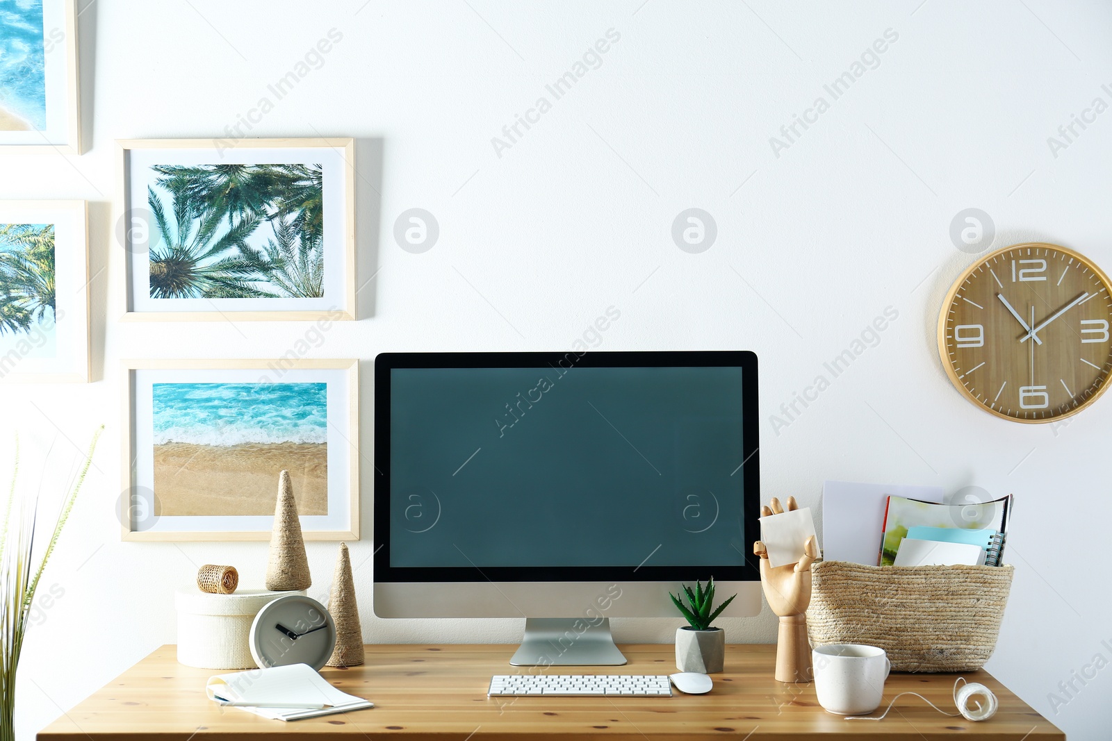 Photo of Modern computer and office supplies on wooden table, space for text. Designer's workplace