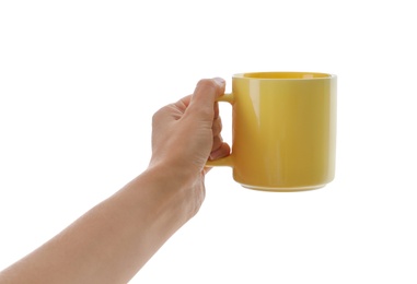 Photo of Woman holding elegant yellow cup on white background, closeup