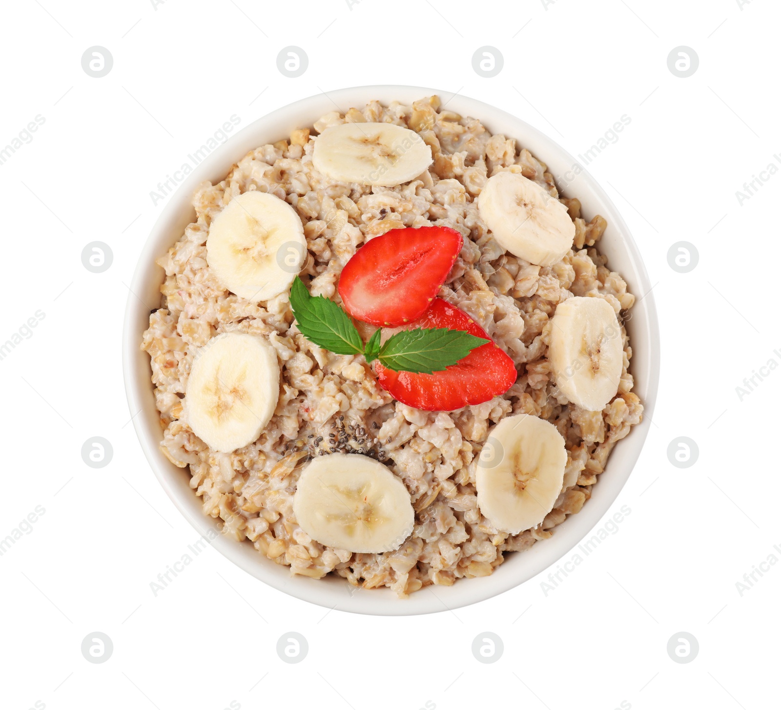 Photo of Tasty boiled oatmeal with strawberry and banana in bowl isolated on white, top view