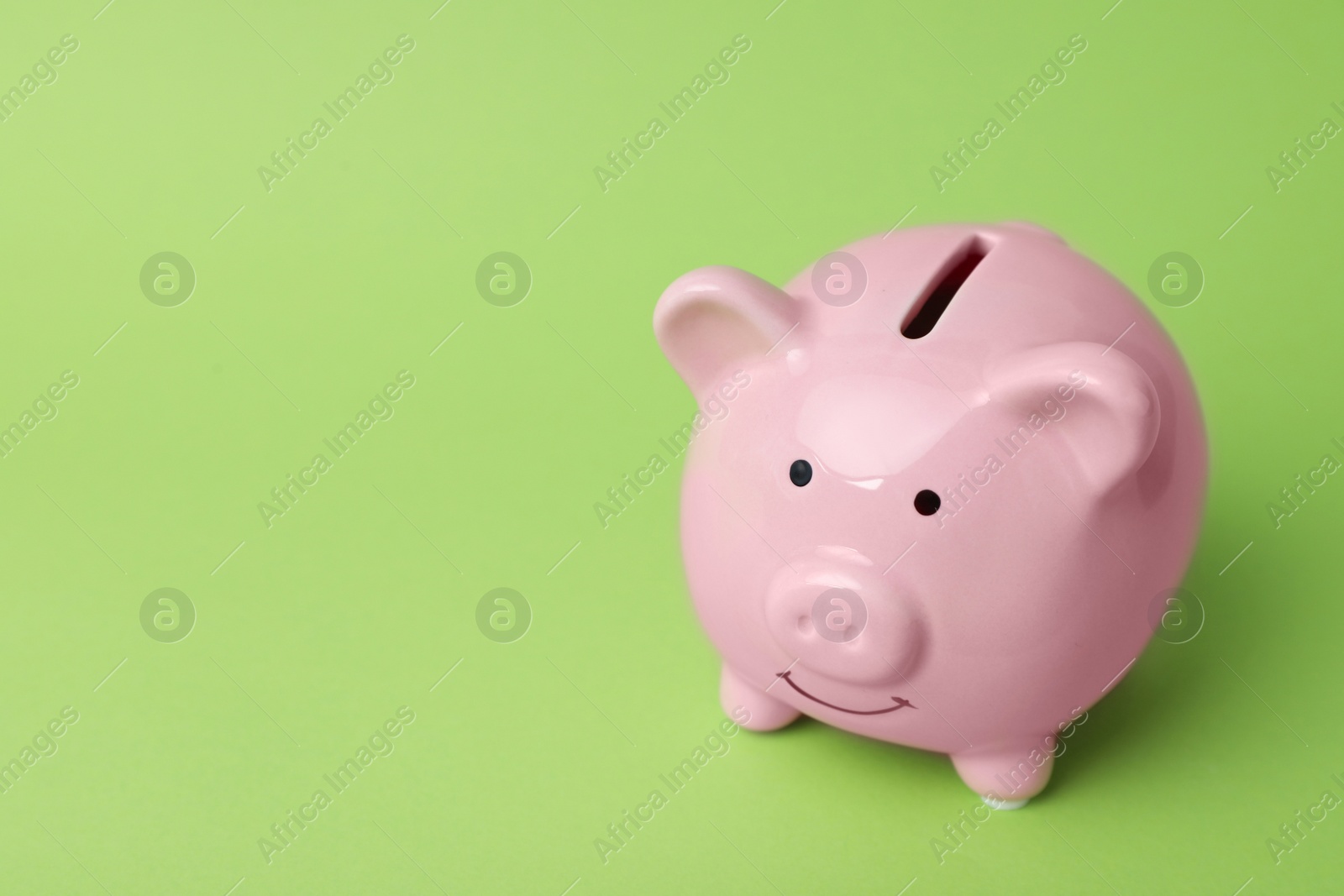 Photo of Pink piggy bank on color background. Money saving