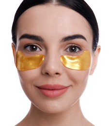 Beautiful young woman with under eye patches on white background