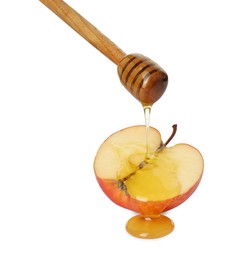 Photo of Pouring tasty honey onto cut apple on white background