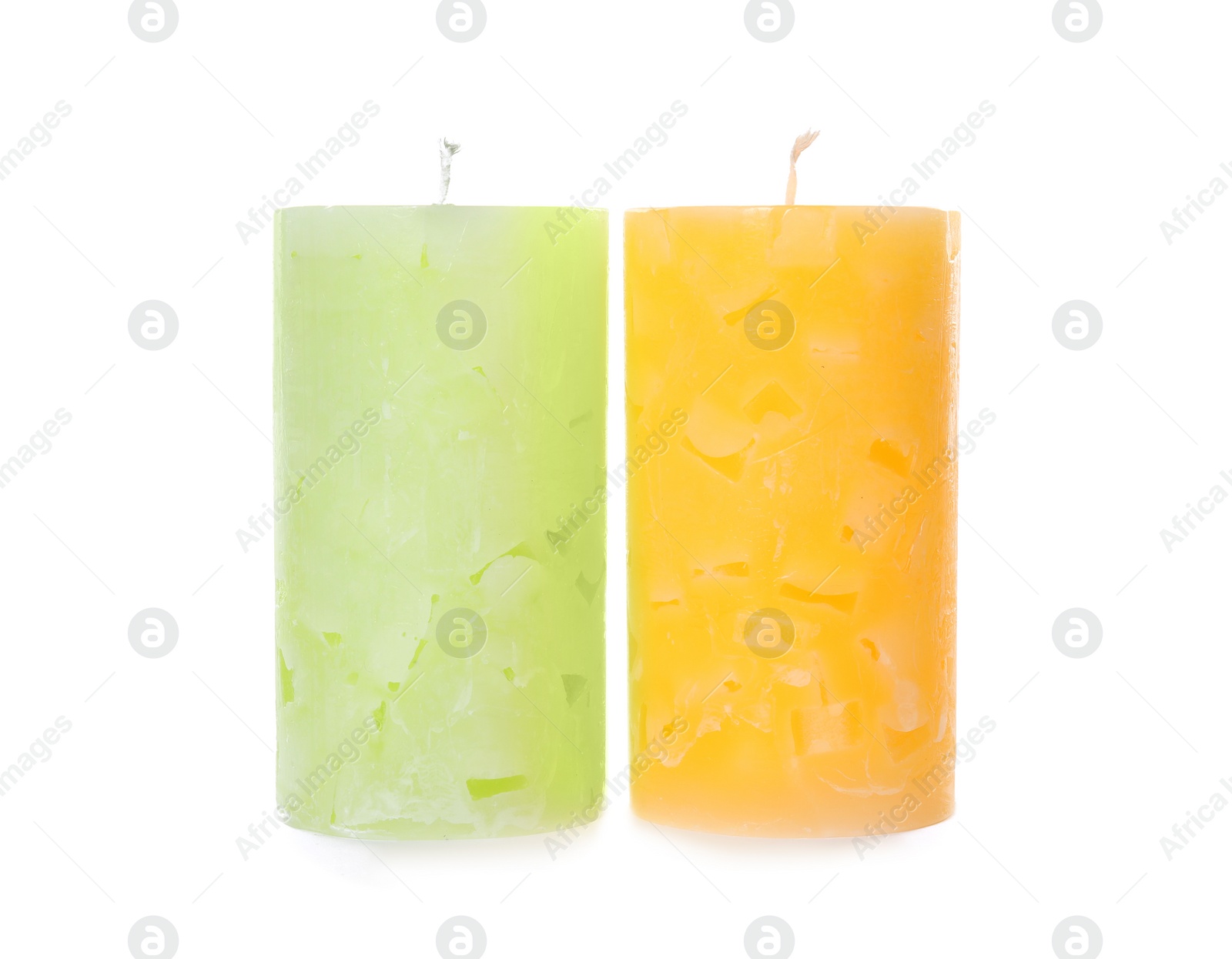 Photo of Two color wax candles on white background