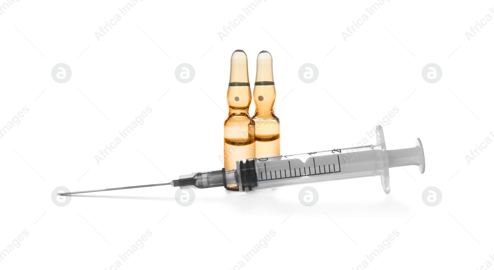 Photo of Syringe and ampules with medicine on white background