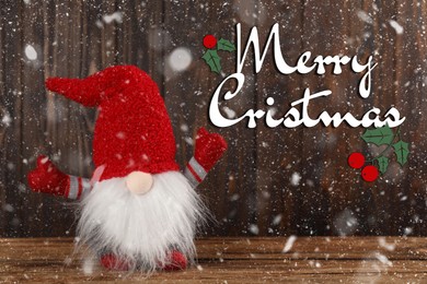 Image of Merry Christmas! Cute gnome on wooden table