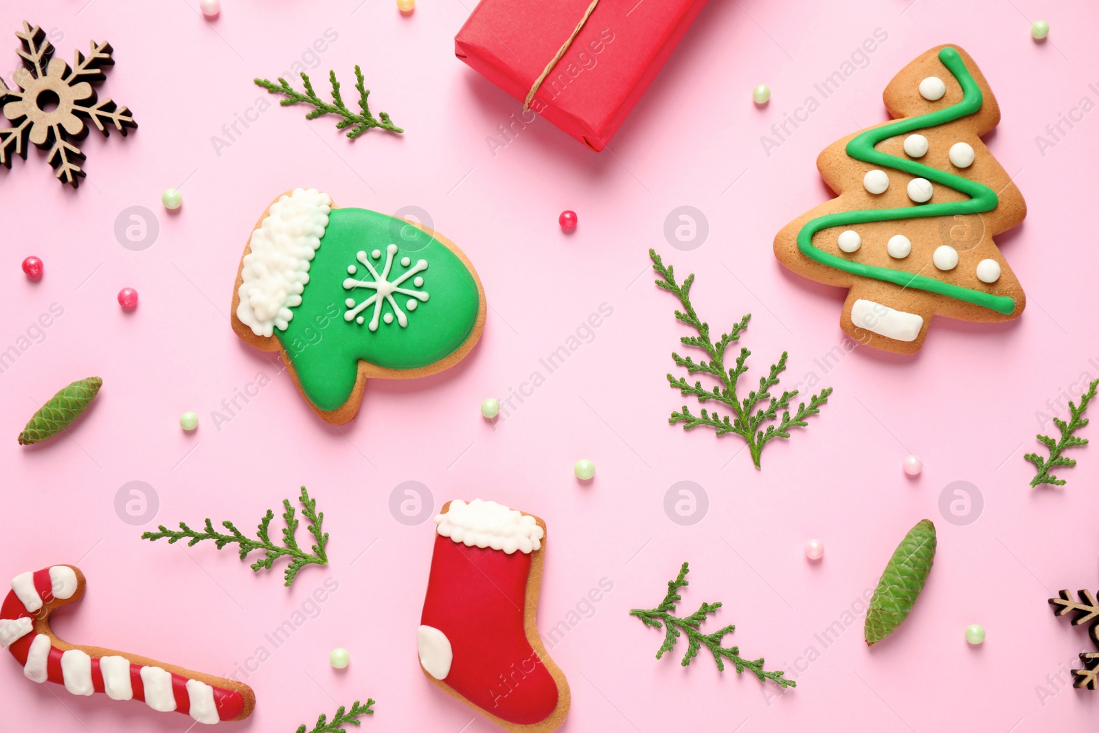 Photo of Flat lay composition with Christmas decorations on pink background