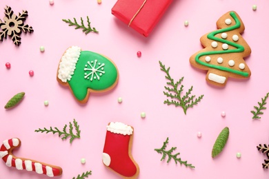 Flat lay composition with Christmas decorations on pink background