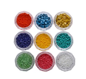 Photo of Plastic containers with different beads on white background, top view