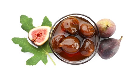 Photo of Bowl of tasty sweet jam, fresh figs and green leaf isolated on white, top view