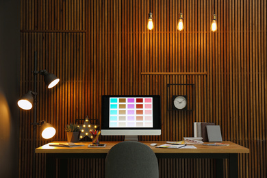 Modern designer's workplace with computer in office