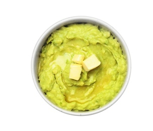 Photo of Bowl with guacamole made of ripe avocados on white background, top view