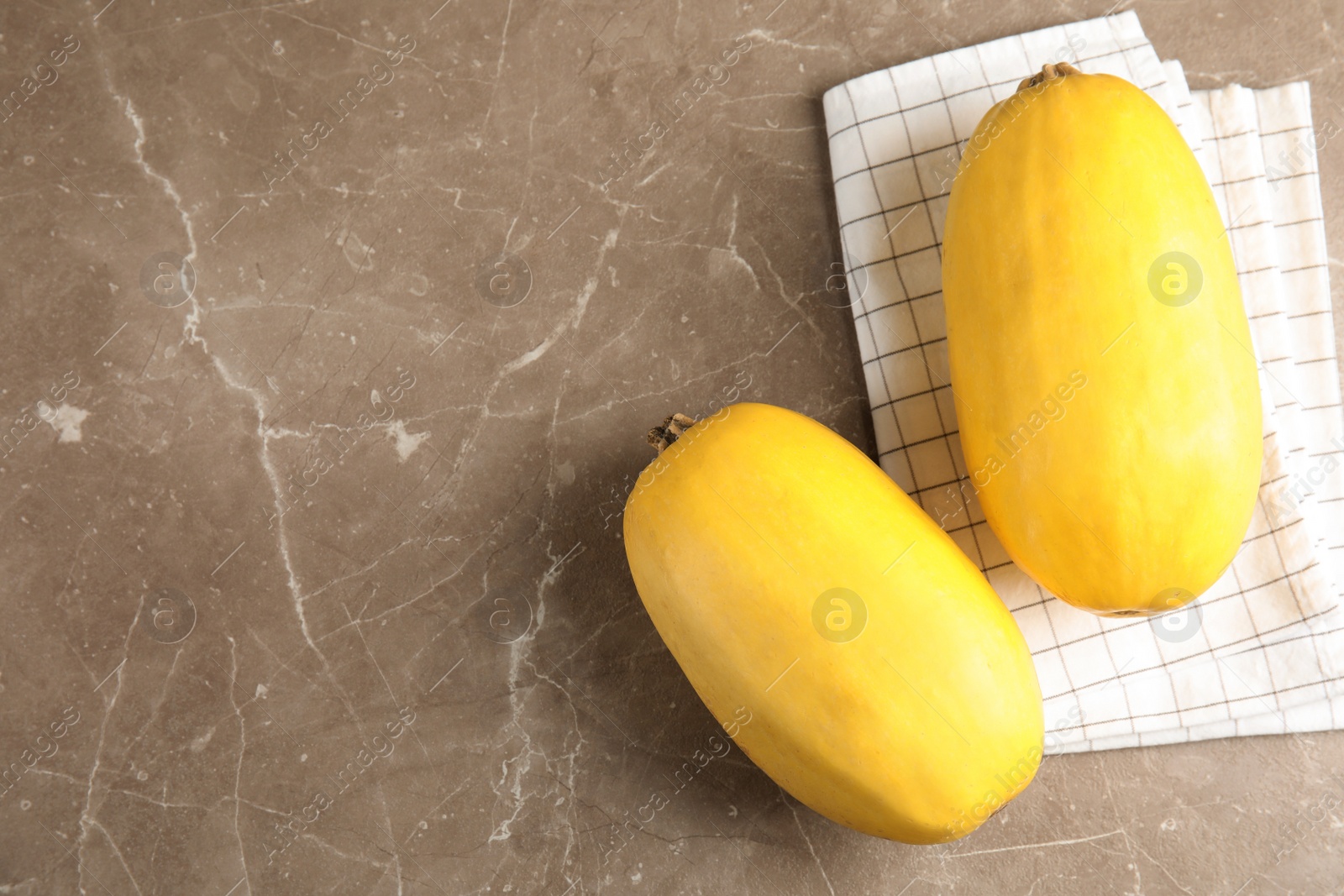 Photo of Flat lay composition with ripe spaghetti squashes on gray background. Space for text