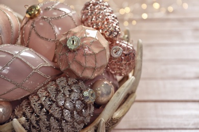 Collection of beautiful Christmas tree baubles on table, closeup