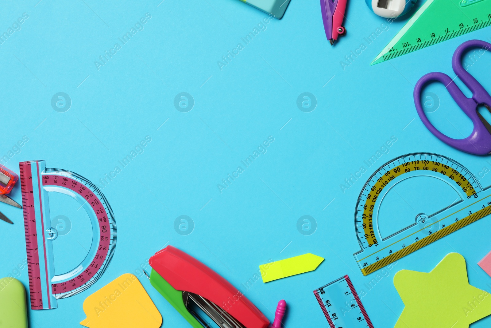 Photo of Different stationery on light blue background, flat lay with space for text. Back to school