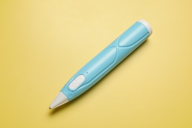 Photo of Stylish 3D pen on yellow background, top view